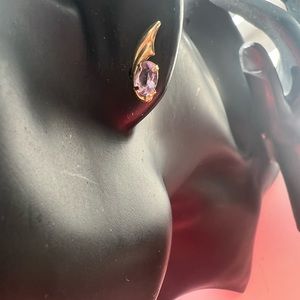 14k yellow gold wings with an amethyst stone earrings .
